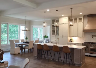 A large open kitchen with hardwood floors and a dining area.